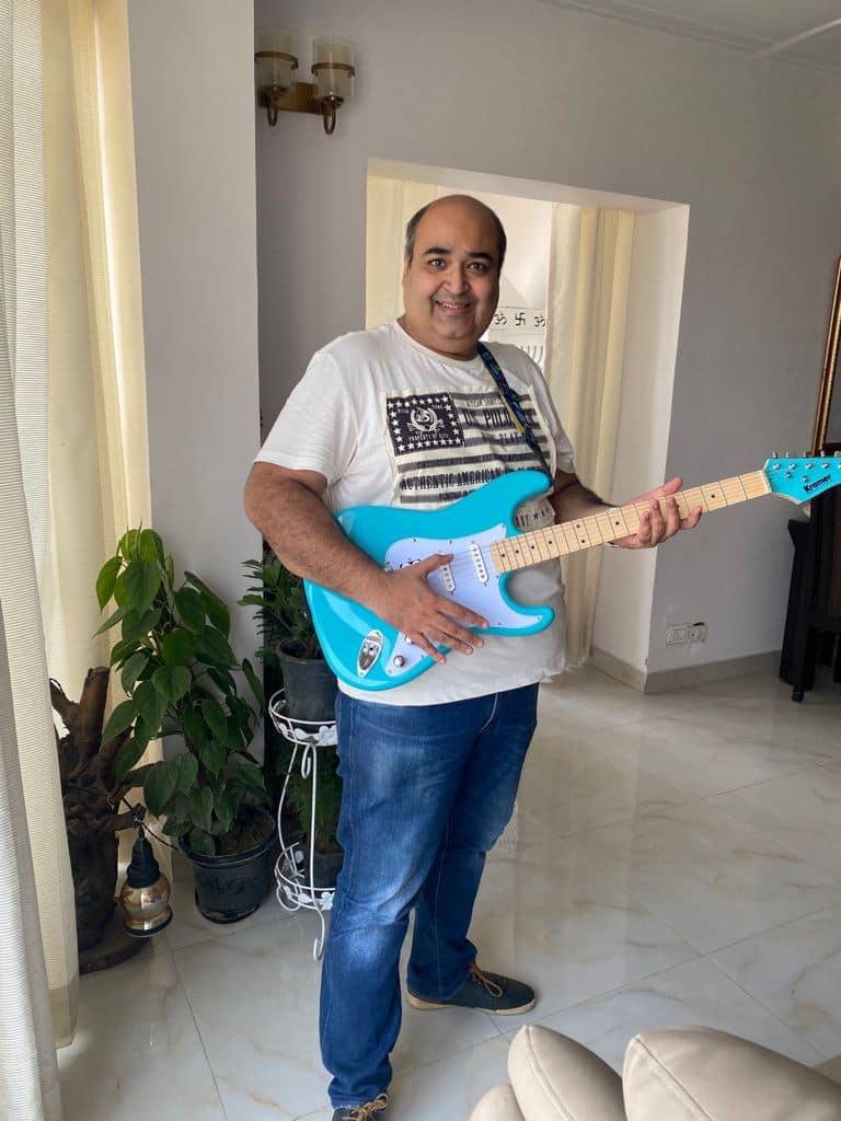Picture of Tarun Lakhanpal holding a guitar